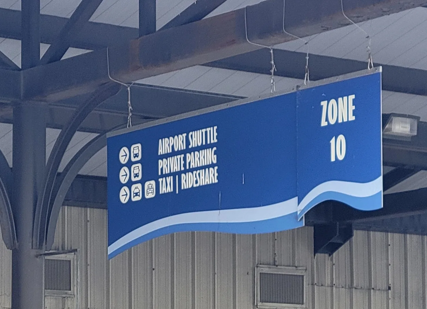Zone 10 airport shuttle, private parking and rideshare pickup sign at Galveston Cruise Terminal 28